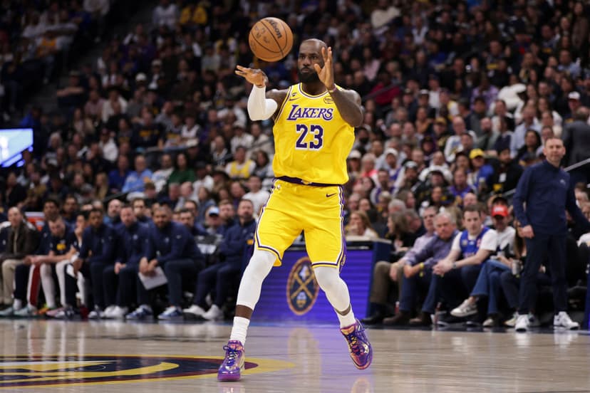 LeBron sets field goal record, exits with elbow injury in defeat