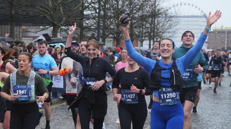 Thousands brave rain and wind for half marathon