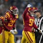 Some USC Football Players Sporting White Stripe on Helmets