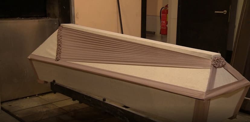 How are people without relatives buried in Latvia?