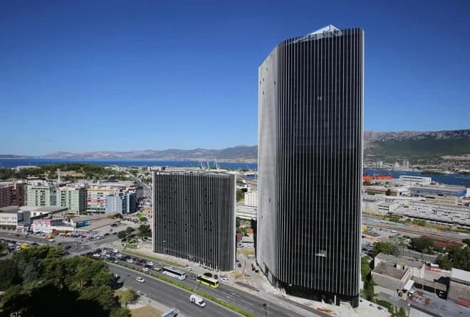 Skydiver Jumps from Split Skyscraper, Lands on Car