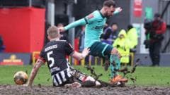 Wolves Advance in FA Cup After Muddy Victory Over Grimsby