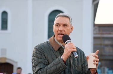 Hungarian Minister Poses with Anti-Government Slogan