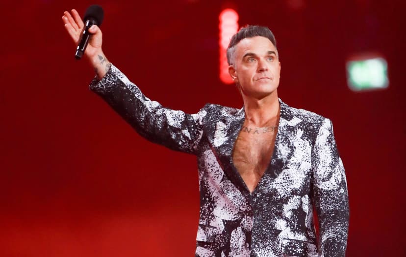 Watch Robbie Williams lead Ozzy Osbourne tribute at BRITs 2026 with ‘No More Tears’